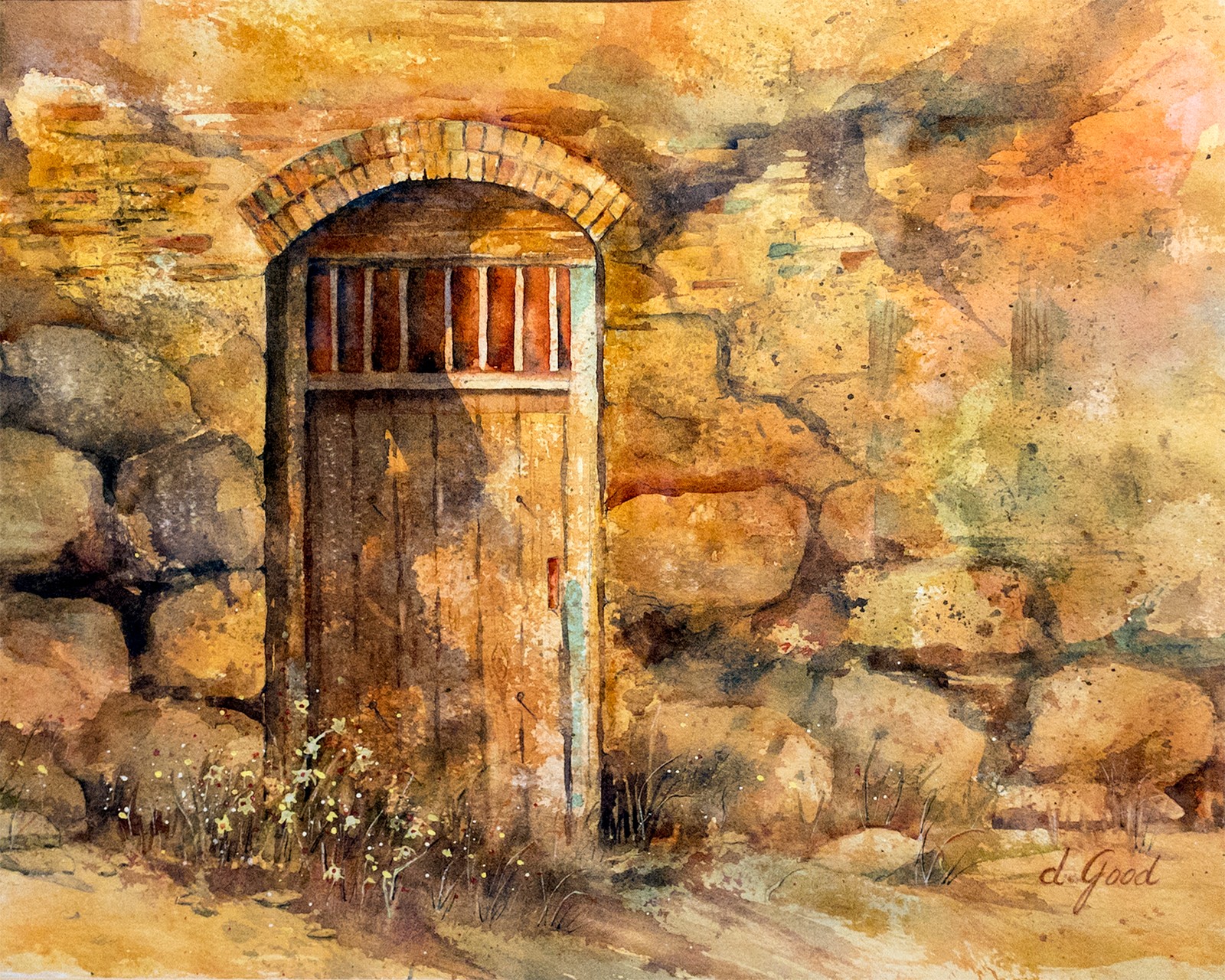 Warm ochre stone surrounds a rounded wooden doorway, with small plants growing along the wall.