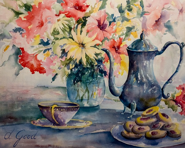 Flowers, a blue pitcher, a teacup and small pastries share the table.